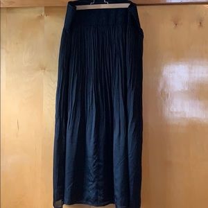 Black pleated maxi skirt with slit